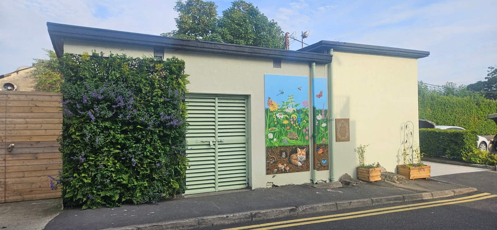 a living wall with colourful mural painted on it
